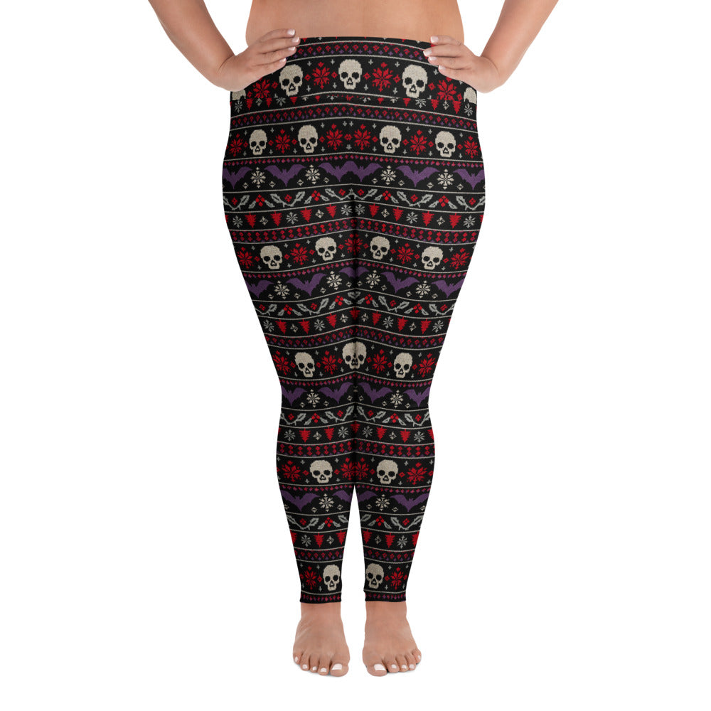 Merry Skull-Mas plus size horror Christmas leggings featuring faux-knit skulls, bats, snowflakes and festive red, purple and white patterns on black.