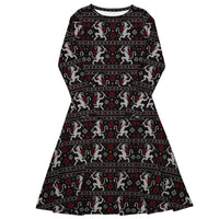 Krampusnacht long sleeve midi dress featuring white Krampus figures, red snowflakes and a black faux-knit ugly sweater-inspired pattern.