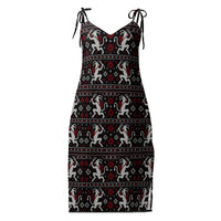 Krampusnacht horror Christmas slip dress featuring white Krampus figures, red snowflakes and a black faux-knit pattern on flowing chiffon.
