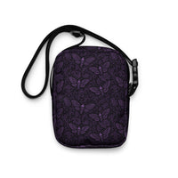 Soul’s Messenger Purple utility crossbody bag featuring supernatural death moth horror artwork from the Memento Mori collection.